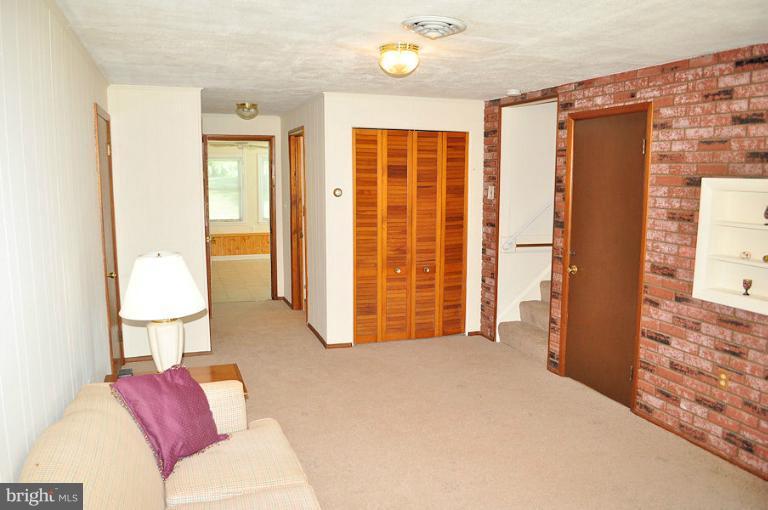 1407 Mt Airy Road Rosedale, MD 21237 - Photo 3 of 27 Family room leads to sunroom in rear