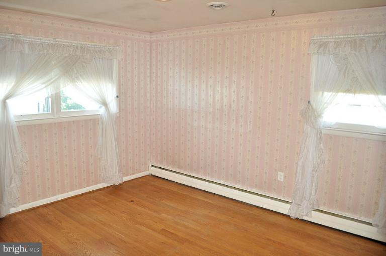 1407 Mt Airy Road Rosedale, MD 21237 - Photo 21 of 27 2nd bedroom has hardwood floor & lots of light