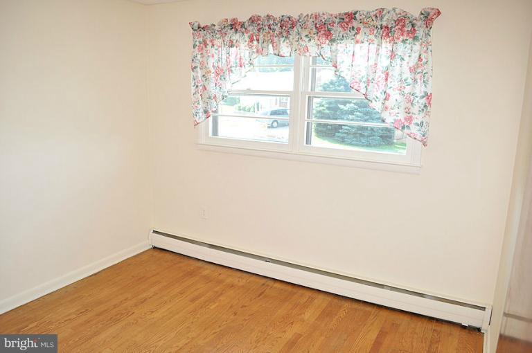 1407 Mt Airy Road Rosedale, MD 21237 - Photo 6 of 27 3rd bedroom has hardwood floor & lots of light