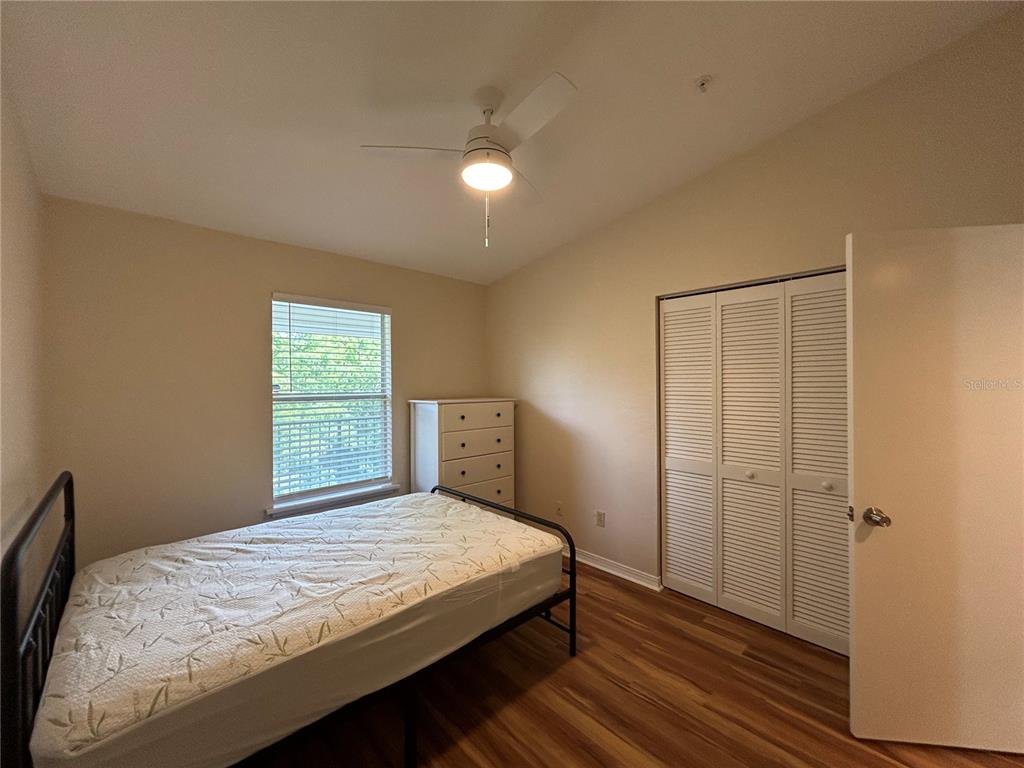 2360 Southwest Archer Road, Unit 1012 Gainesville, FL 32608 - Photo 12 of 28 a bedroom with a bed and a window