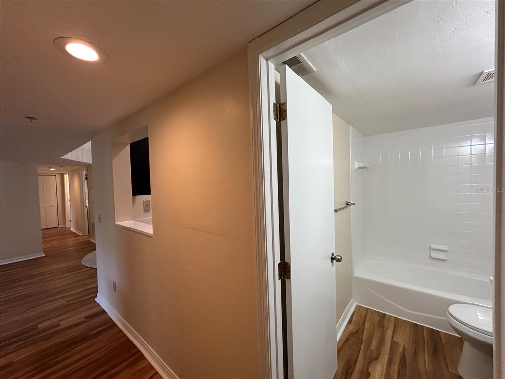 2360 Southwest Archer Road, Unit 1012 Gainesville, FL 32608 - Photo 13 of 28 a bathroom with a bathtub and a shower