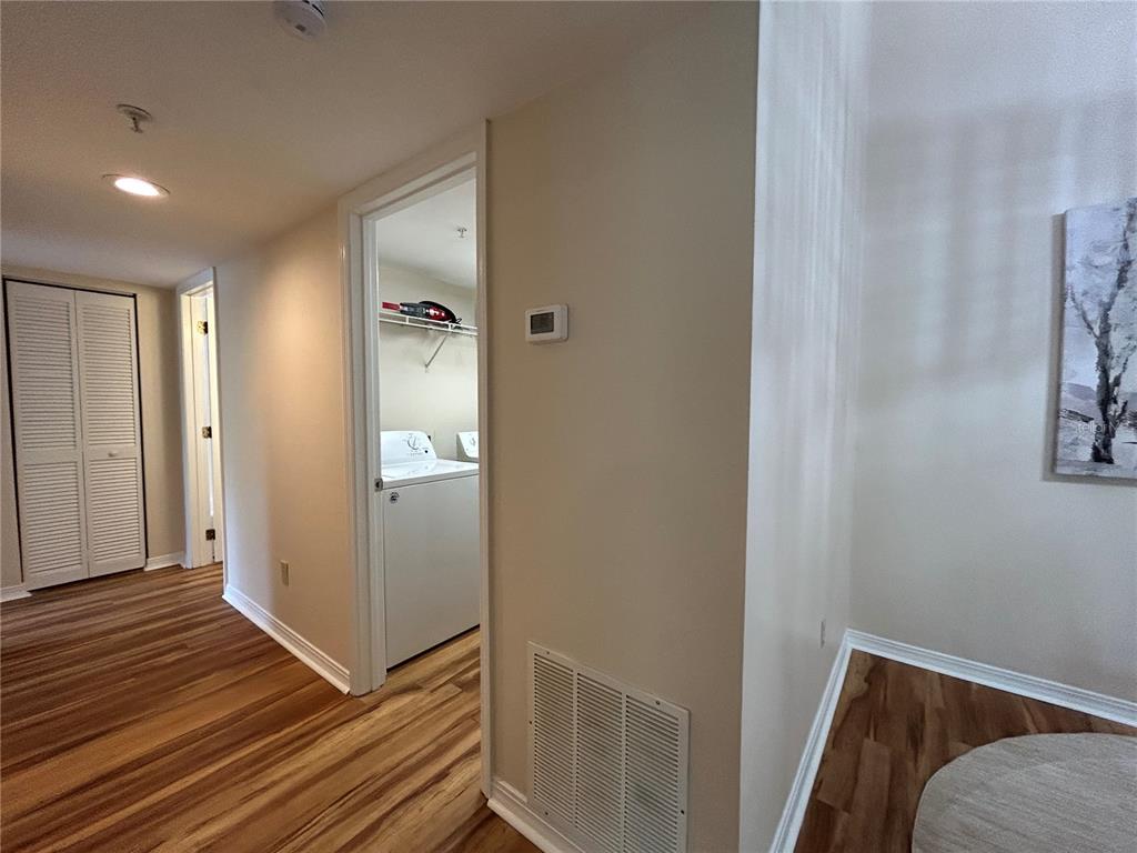 2360 Southwest Archer Road, Unit 1012 Gainesville, FL 32608 - Photo 14 of 28 a view of a hallway and wooden floor