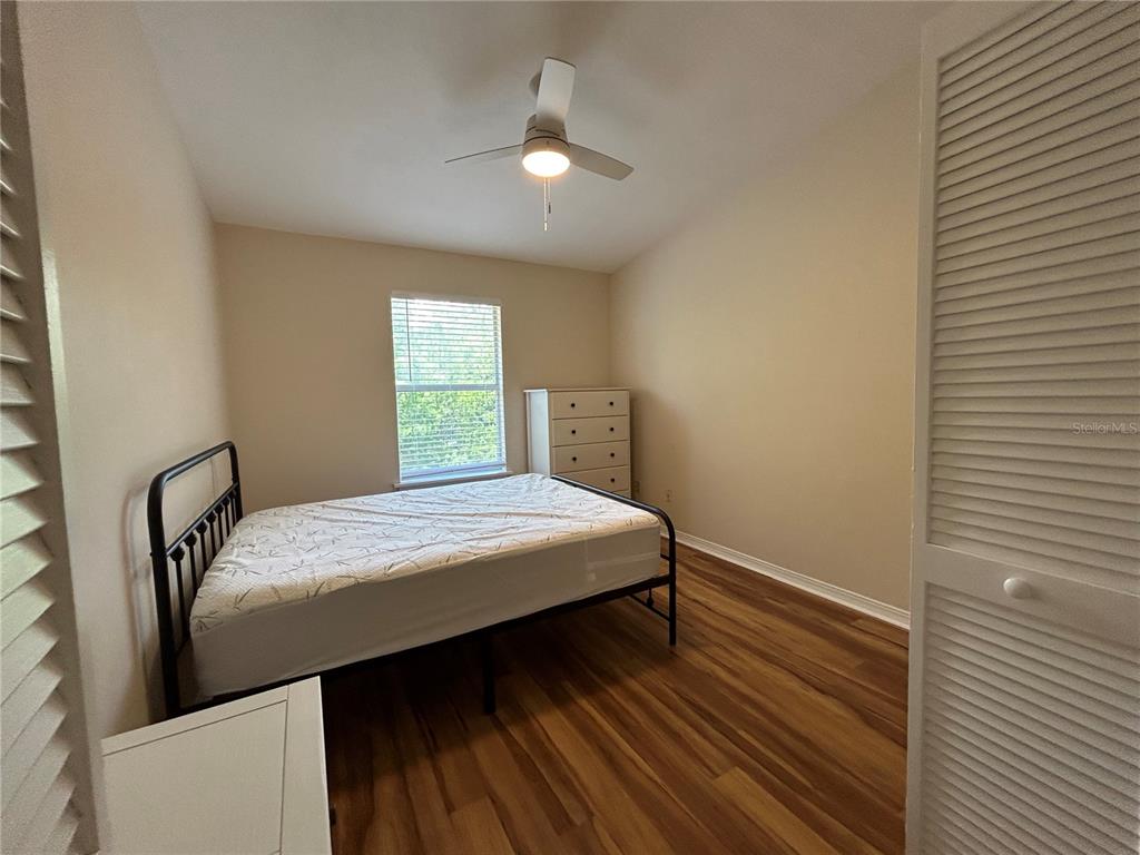 2360 Southwest Archer Road, Unit 1012 Gainesville, FL 32608 - Photo 16 of 28 a bedroom with a bed and a window