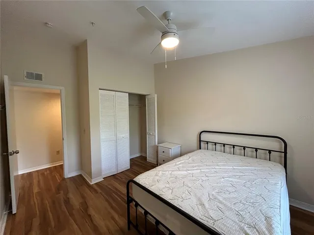 a bedroom with a bed and a dresser