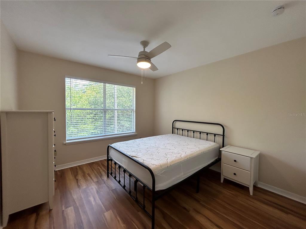 2360 Southwest Archer Road, Unit 1012 Gainesville, FL 32608 - Photo 22 of 28 a bedroom with a bed and a window