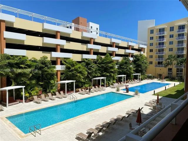 a view of a swimming pool with a lounge chairs