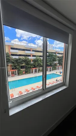 a view of an outdoor space with a large window