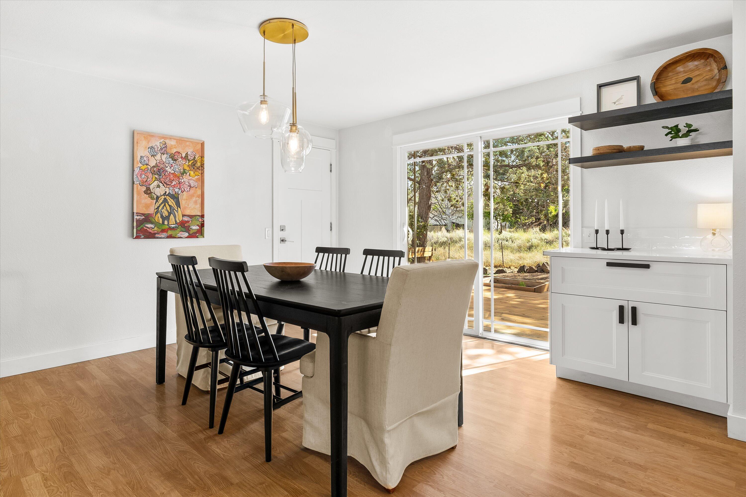 63634 Hunters Circle Bend, OR 97701 - Photo 7 of 28 a view of a dining room with furniture window and wooden floor