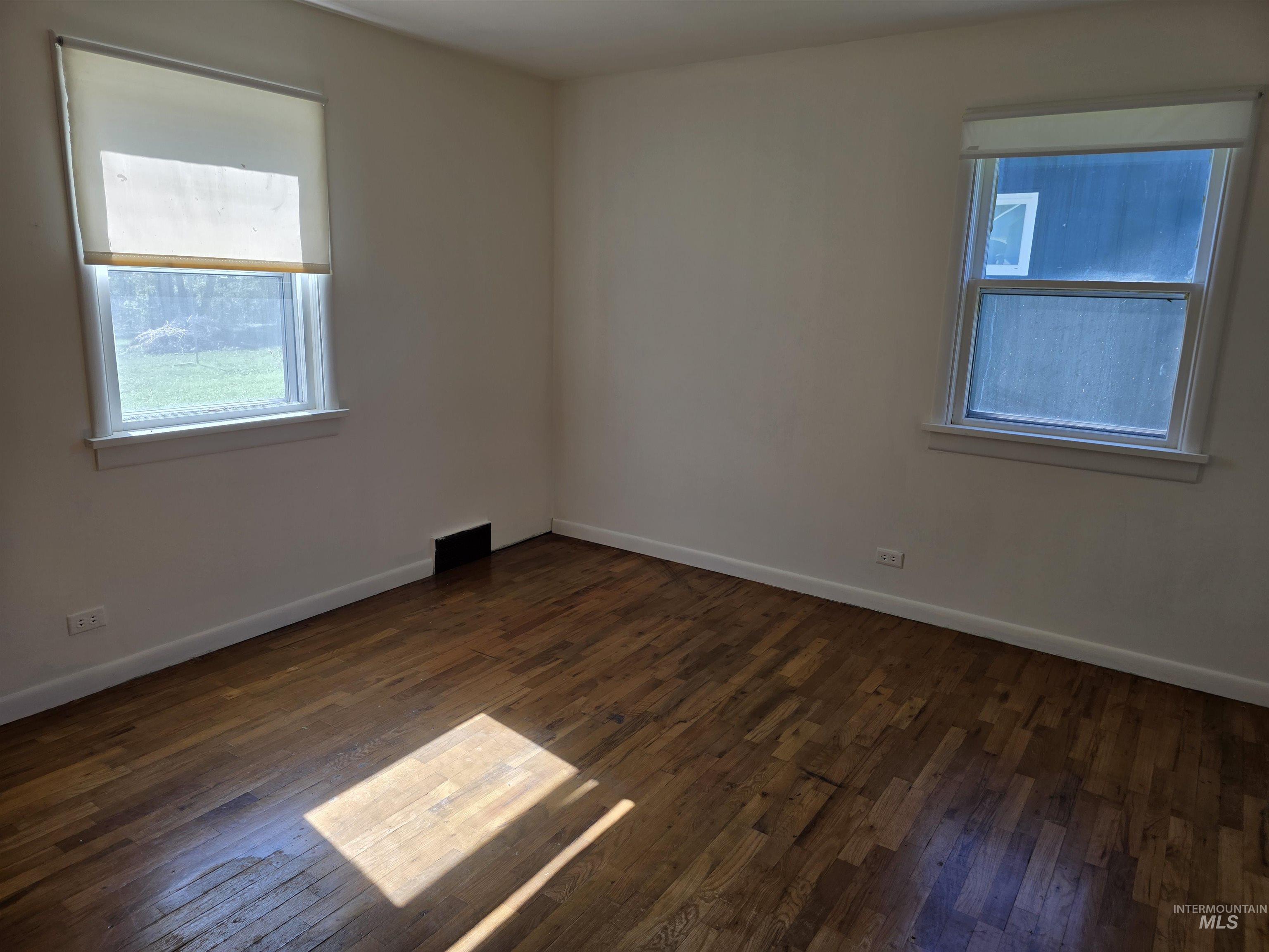 909 12th Street Kamiah, ID 83536 - Photo 15 of 36 featuring baseboards and dark wood finished floors
