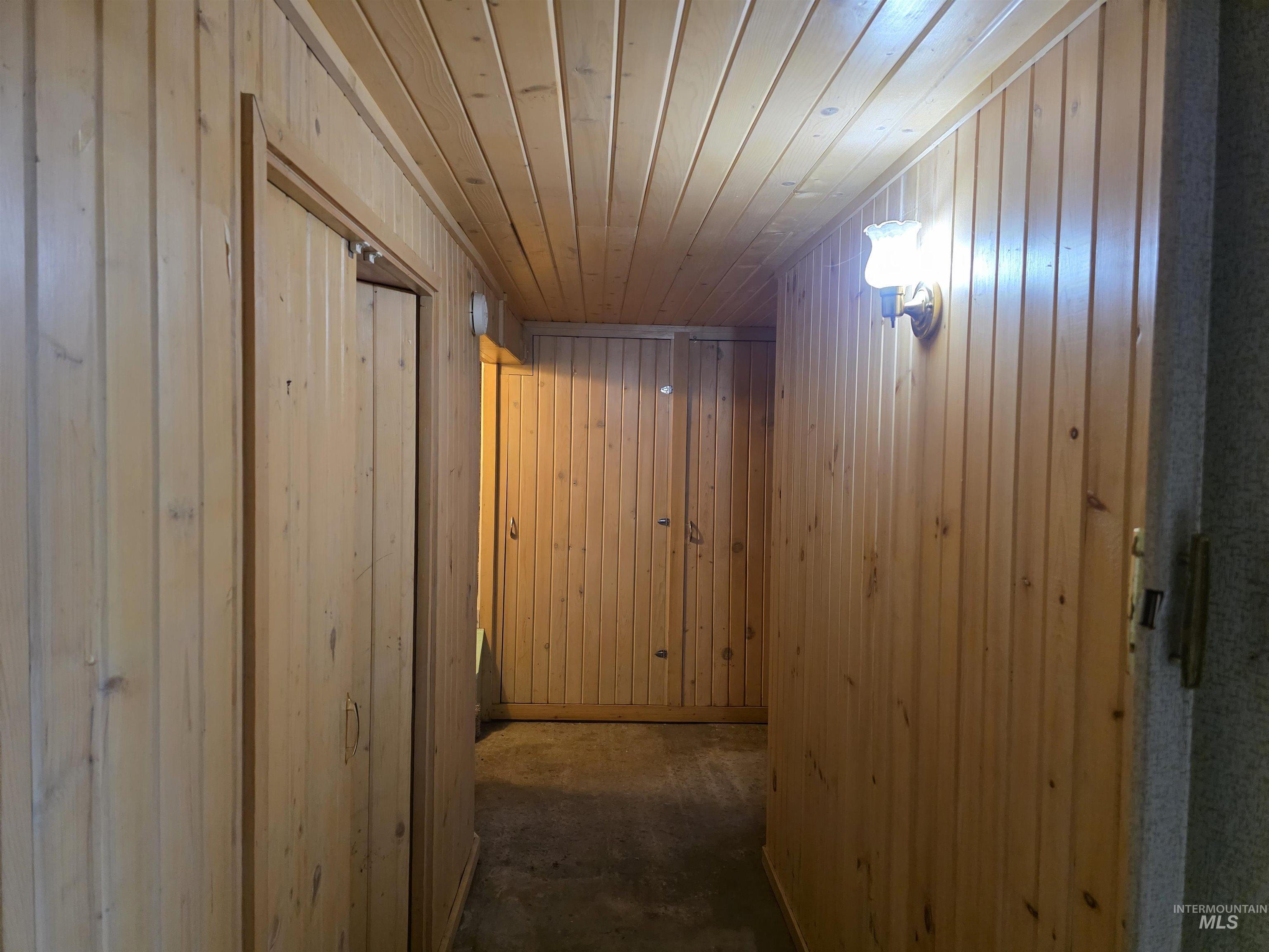 909 12th Street Kamiah, ID 83536 - Photo 28 of 36 Hall with wood walls and wood ceiling
