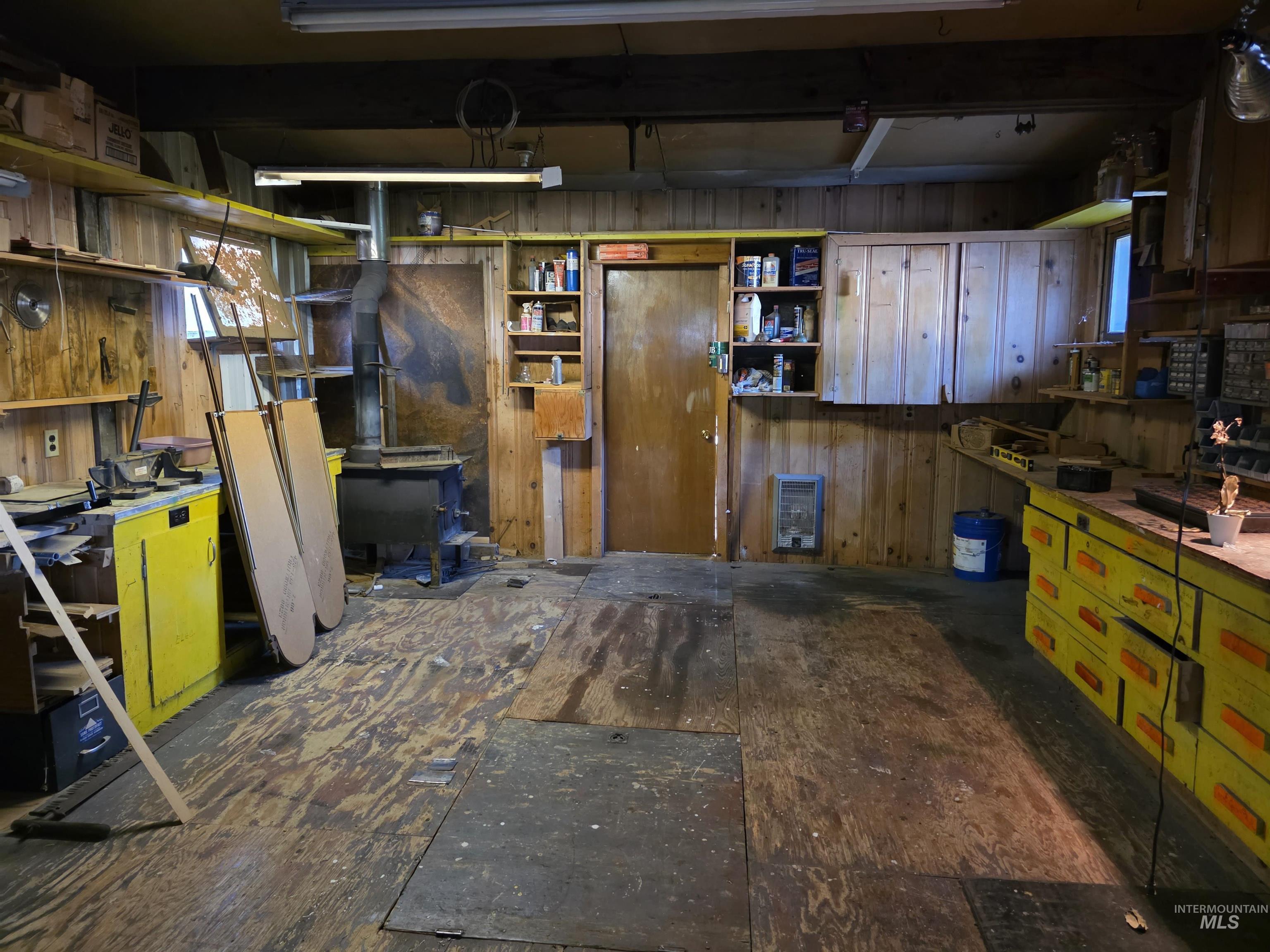 909 12th Street Kamiah, ID 83536 - Photo 32 of 36 Miscellaneous room featuring a workshop area and wood walls