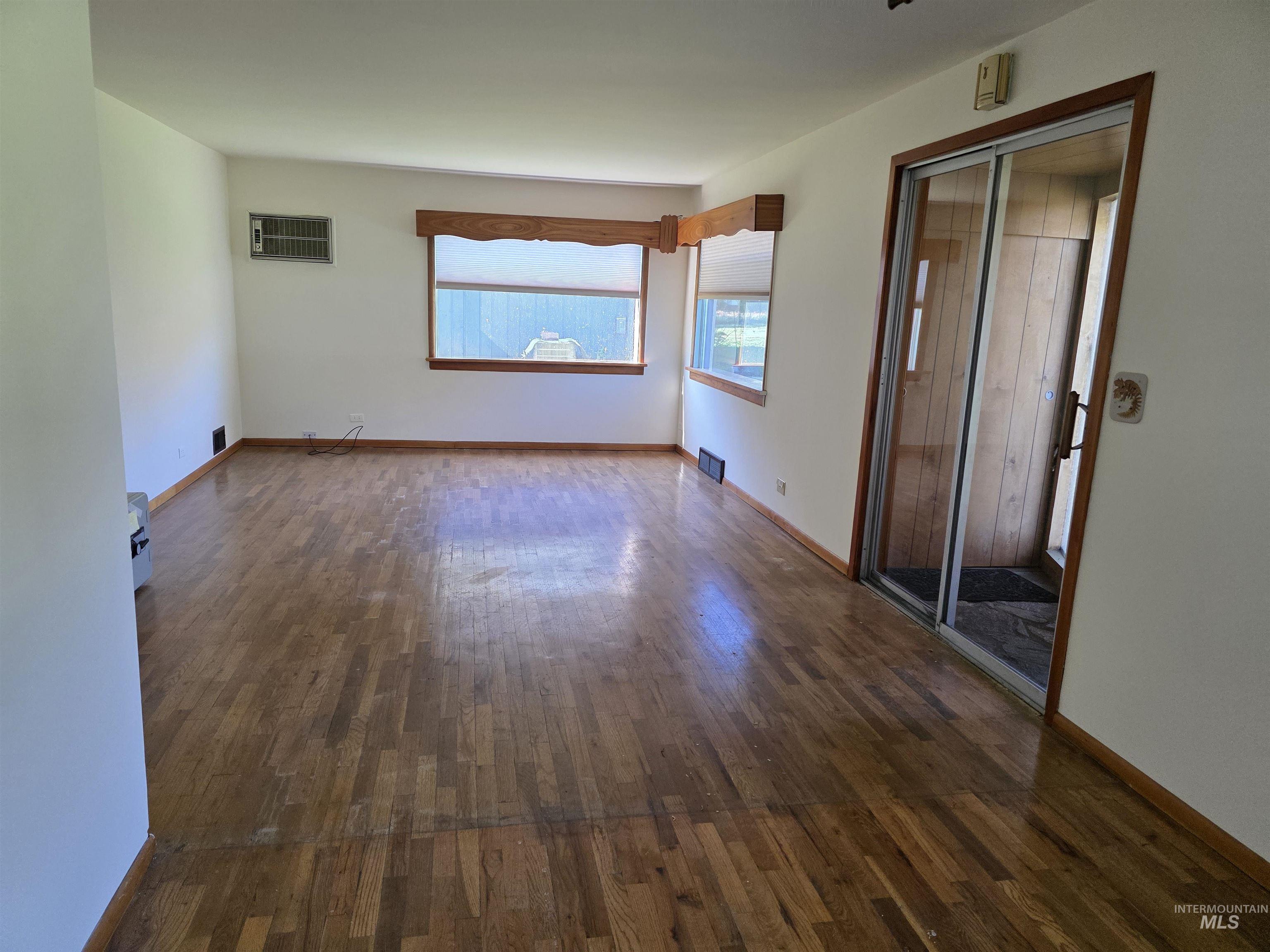 909 12th Street Kamiah, ID 83536 - Photo 8 of 36 Unfurnished room featuring dark wood-style flooring