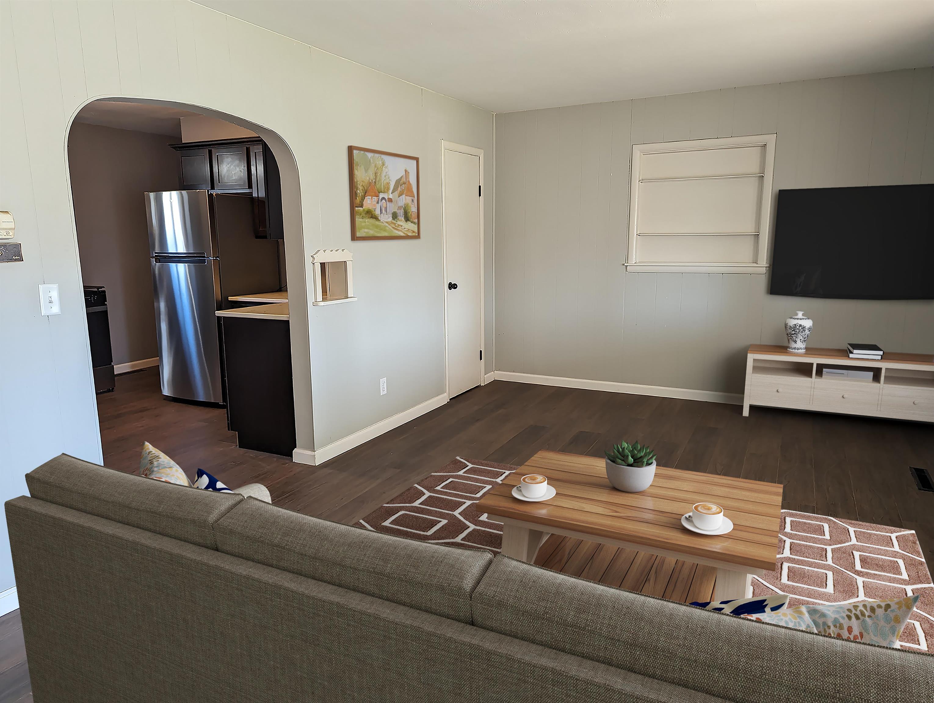 2080 Lancaster Heights Road Freeport, IL 61032 - Photo 3 of 17 a living room with a couch and a flat screen tv