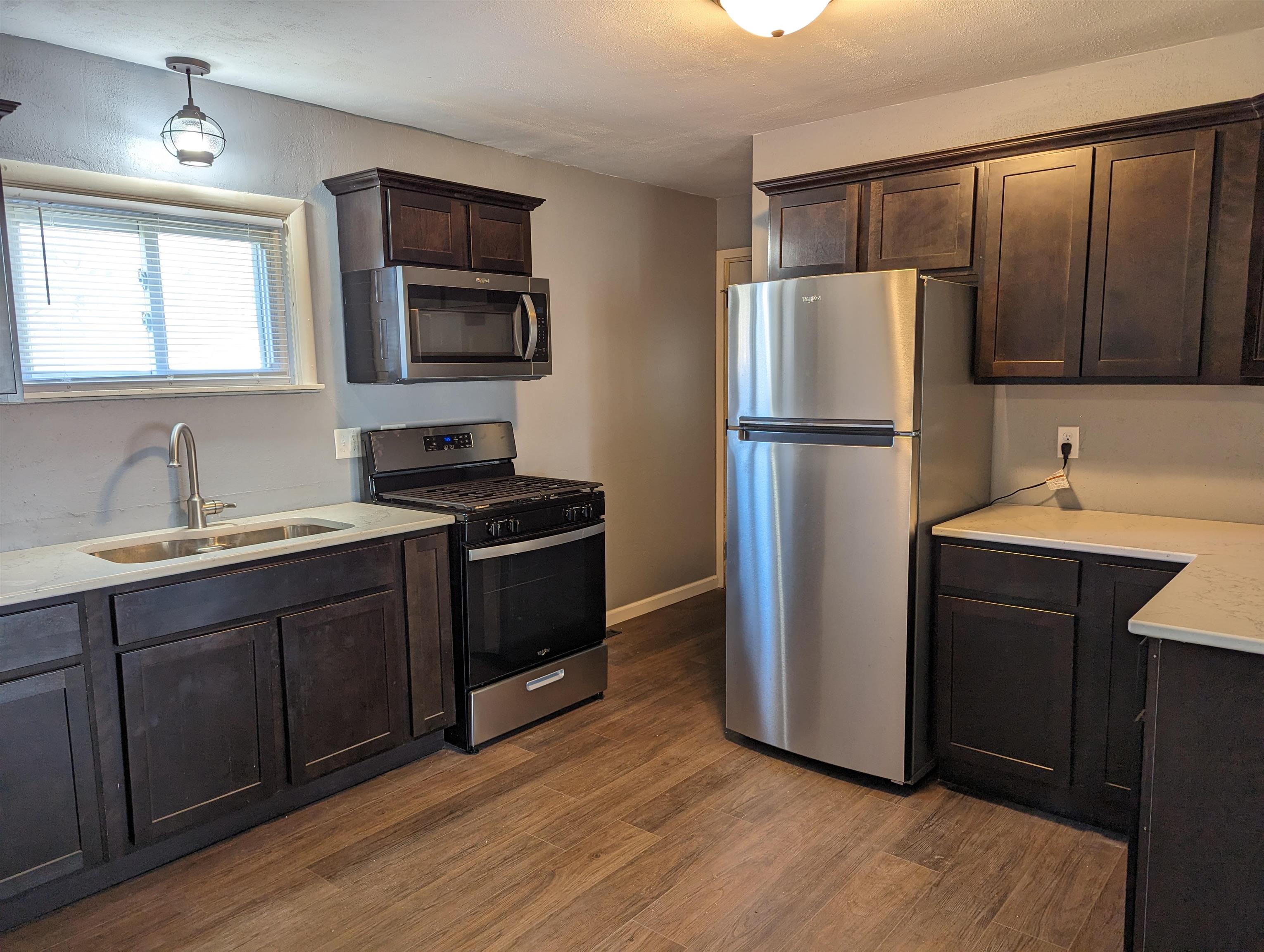 2080 Lancaster Heights Road Freeport, IL 61032 - Photo 6 of 17 a kitchen with a refrigerator sink and microwave