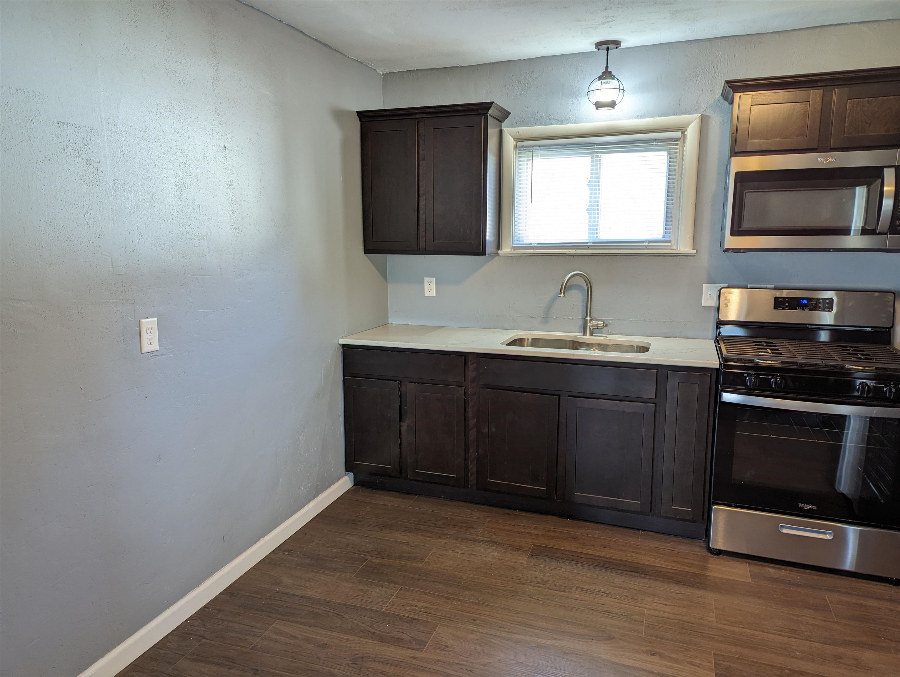 2080 Lancaster Heights Road Freeport, IL 61032 - Photo 7 of 17 a kitchen with a sink and a stove top oven