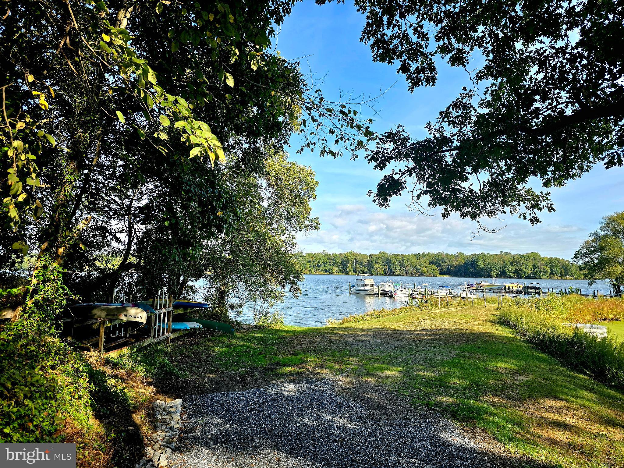 a view of a lake with houses in the back