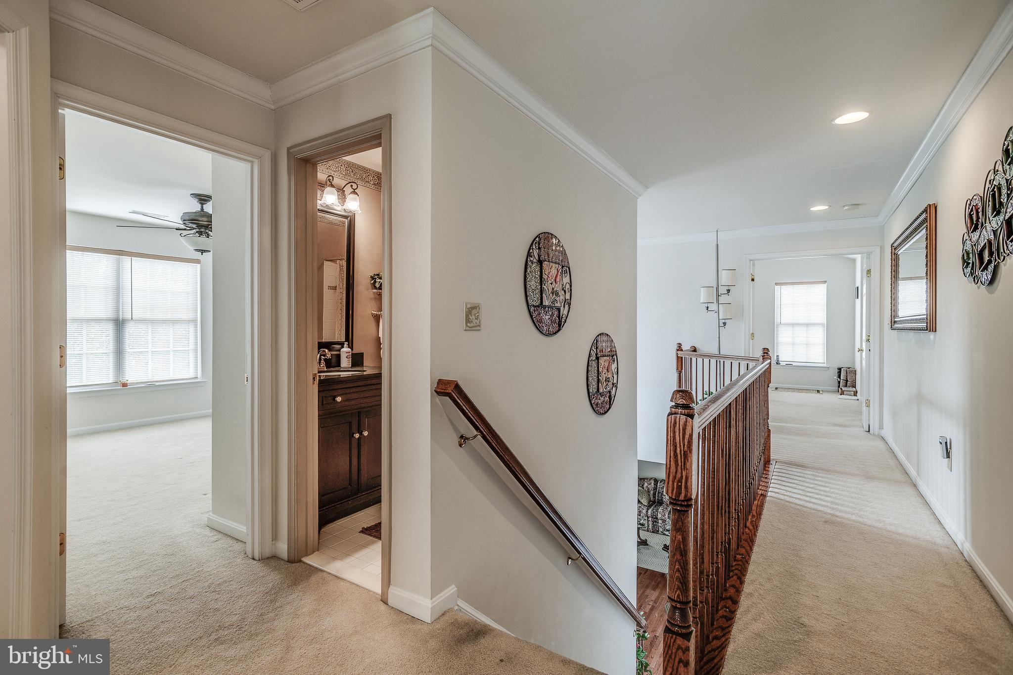 687 Hunters Road Culpeper, VA 22701 - Photo 21 of 57 a view of a hallway with windows and stairs