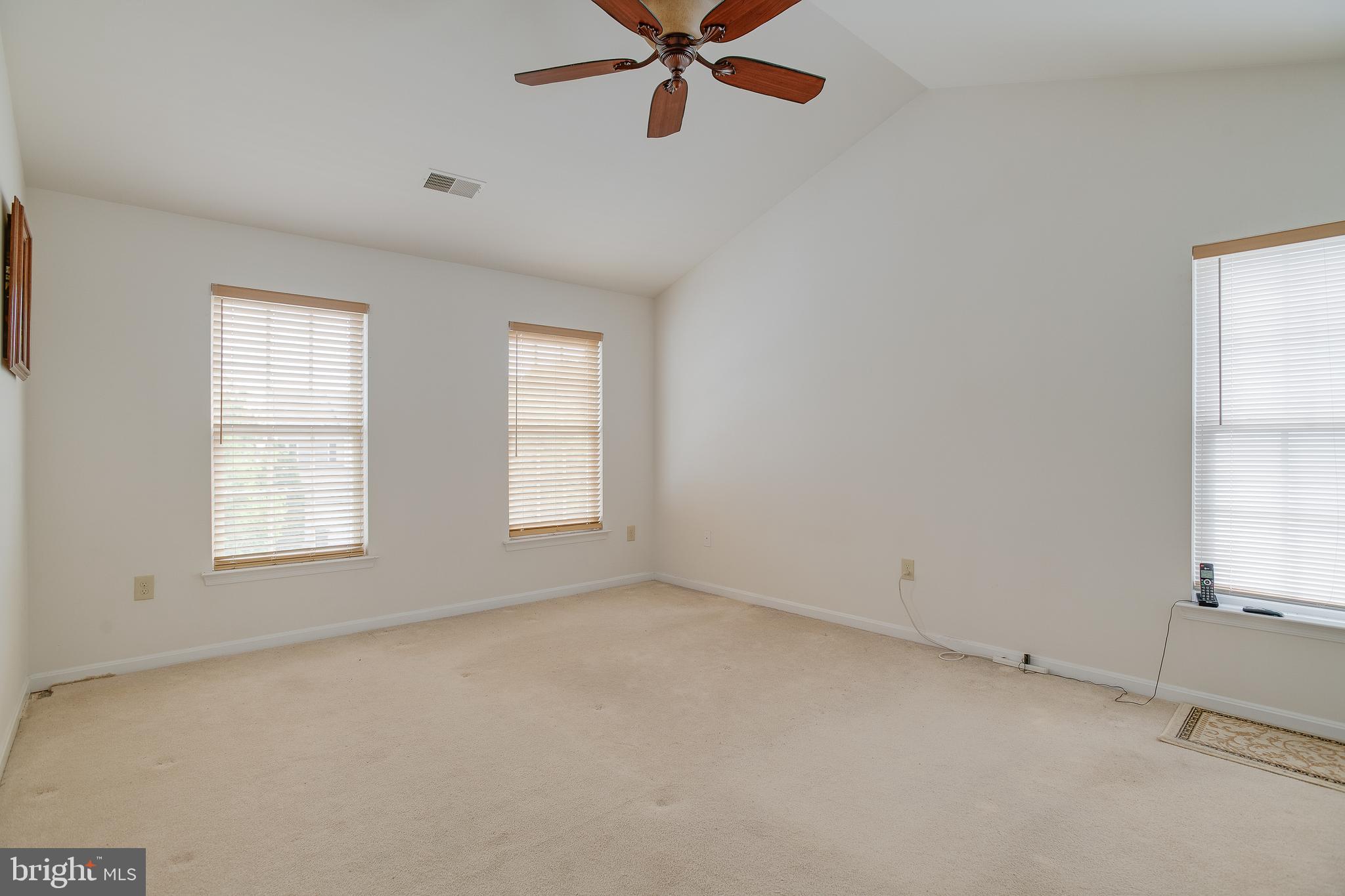 687 Hunters Road Culpeper, VA 22701 - Photo 24 of 57 an empty room with windows and fan