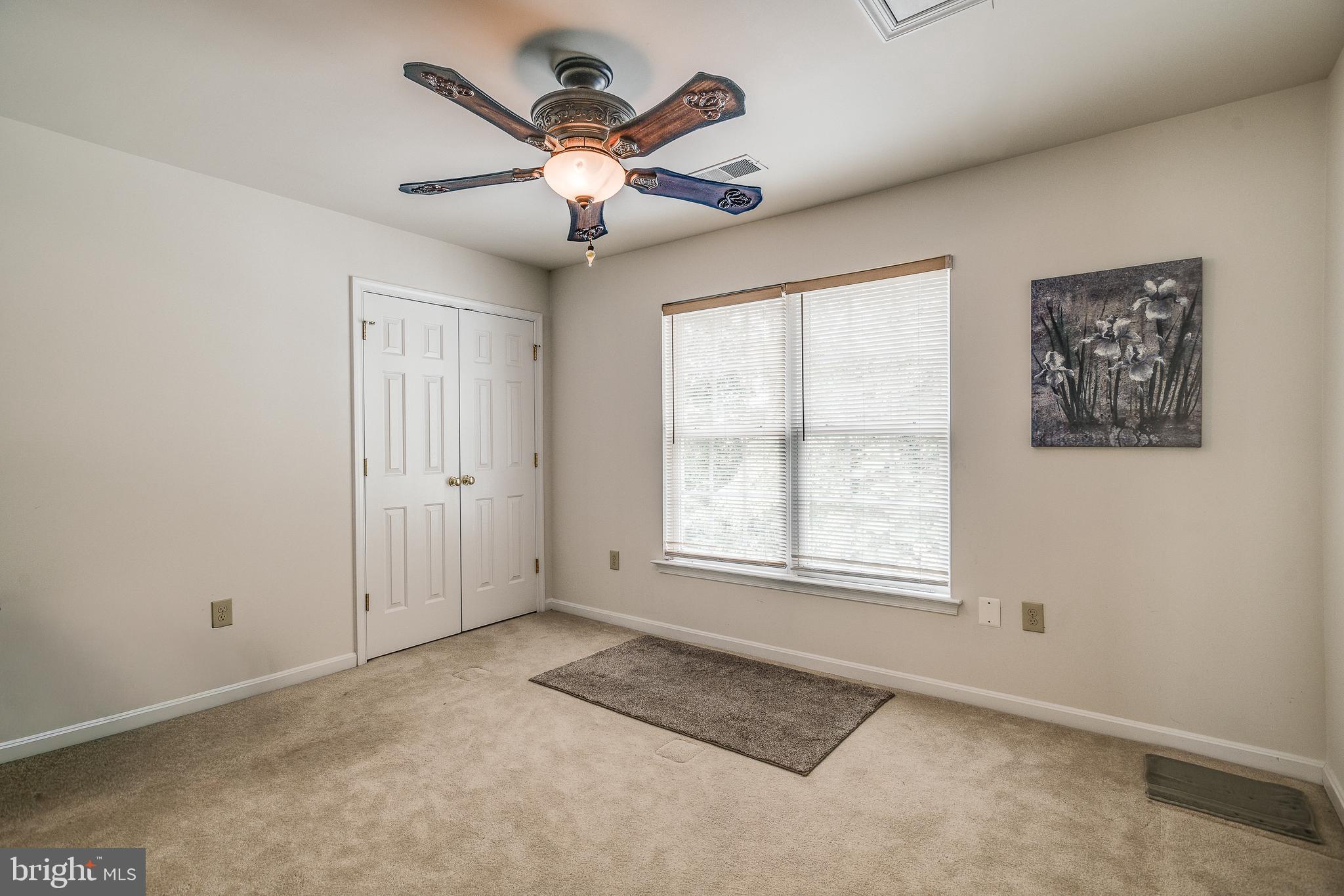 687 Hunters Road Culpeper, VA 22701 - Photo 30 of 57 an empty room with windows and fan
