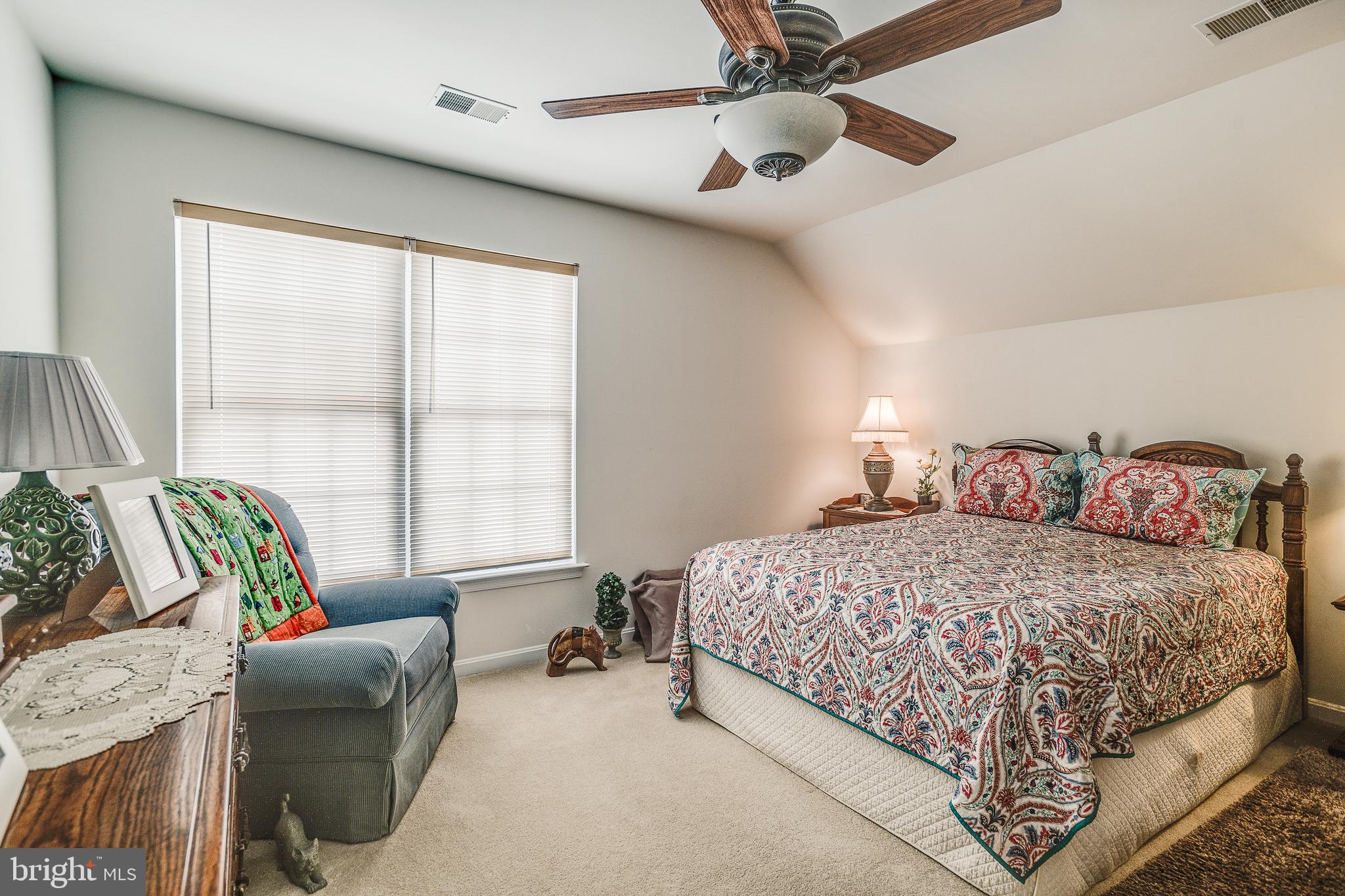 687 Hunters Road Culpeper, VA 22701 - Photo 31 of 57 a bedroom with a bed and a couch