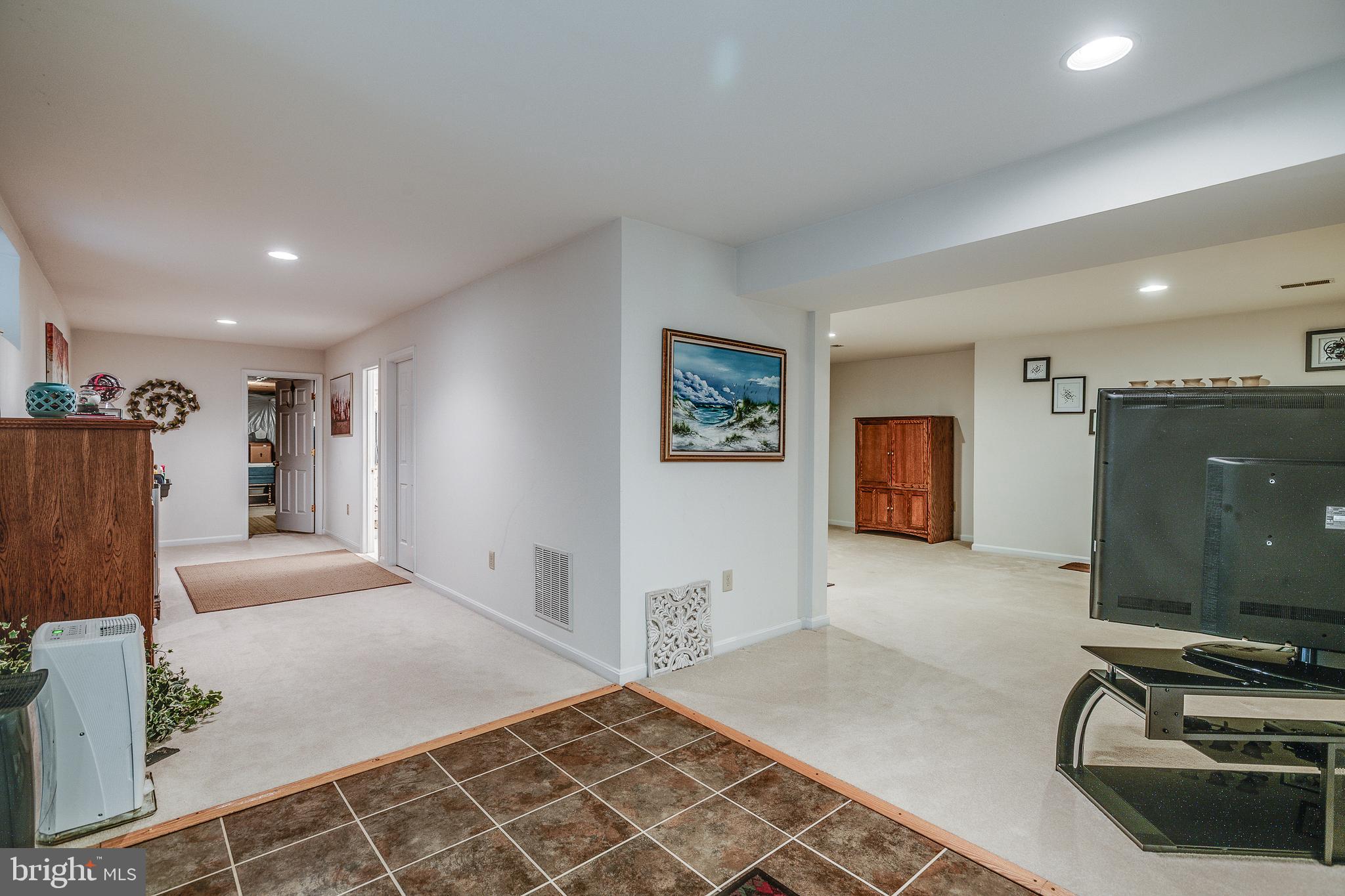 687 Hunters Road Culpeper, VA 22701 - Photo 36 of 57 a bedroom with furniture and a flat screen tv