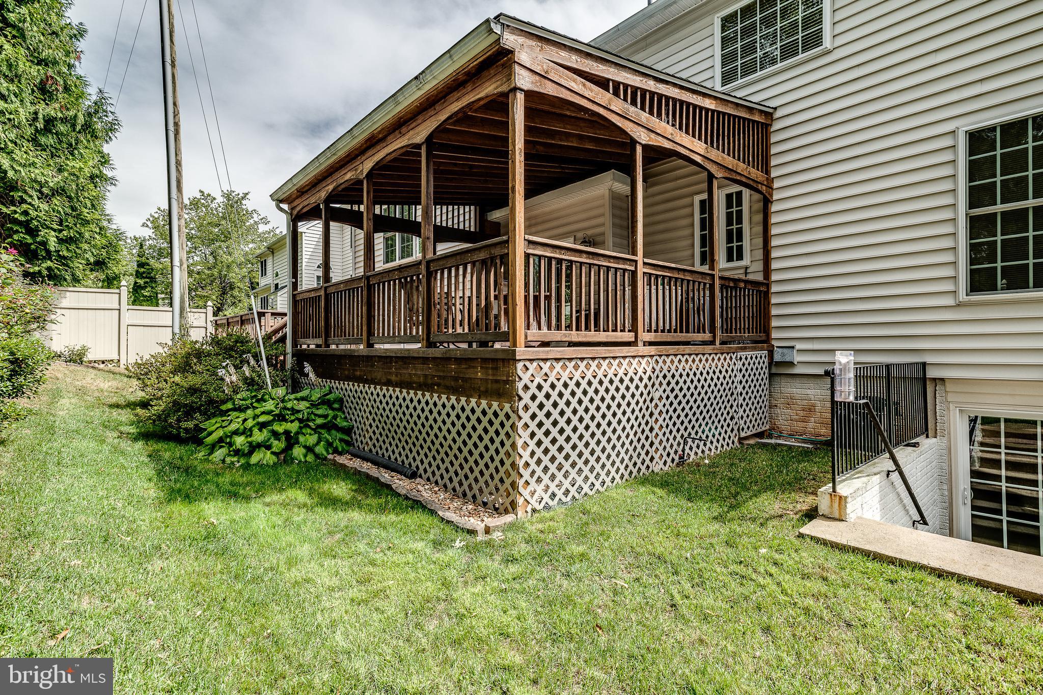 687 Hunters Road Culpeper, VA 22701 - Photo 45 of 57 a view of a house with a small yard and wooden fence