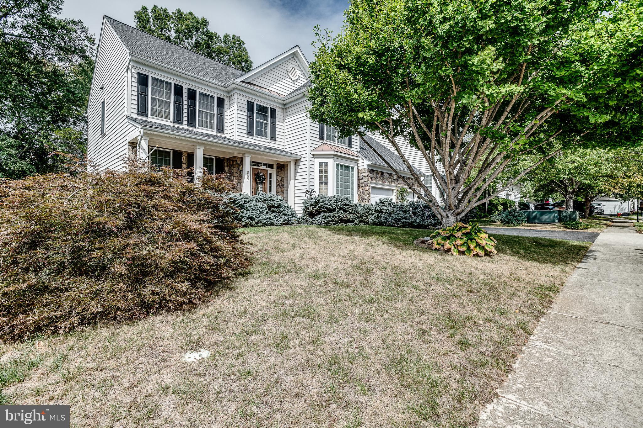 687 Hunters Road Culpeper, VA 22701 - Photo 49 of 57 a front view of a house with a garden