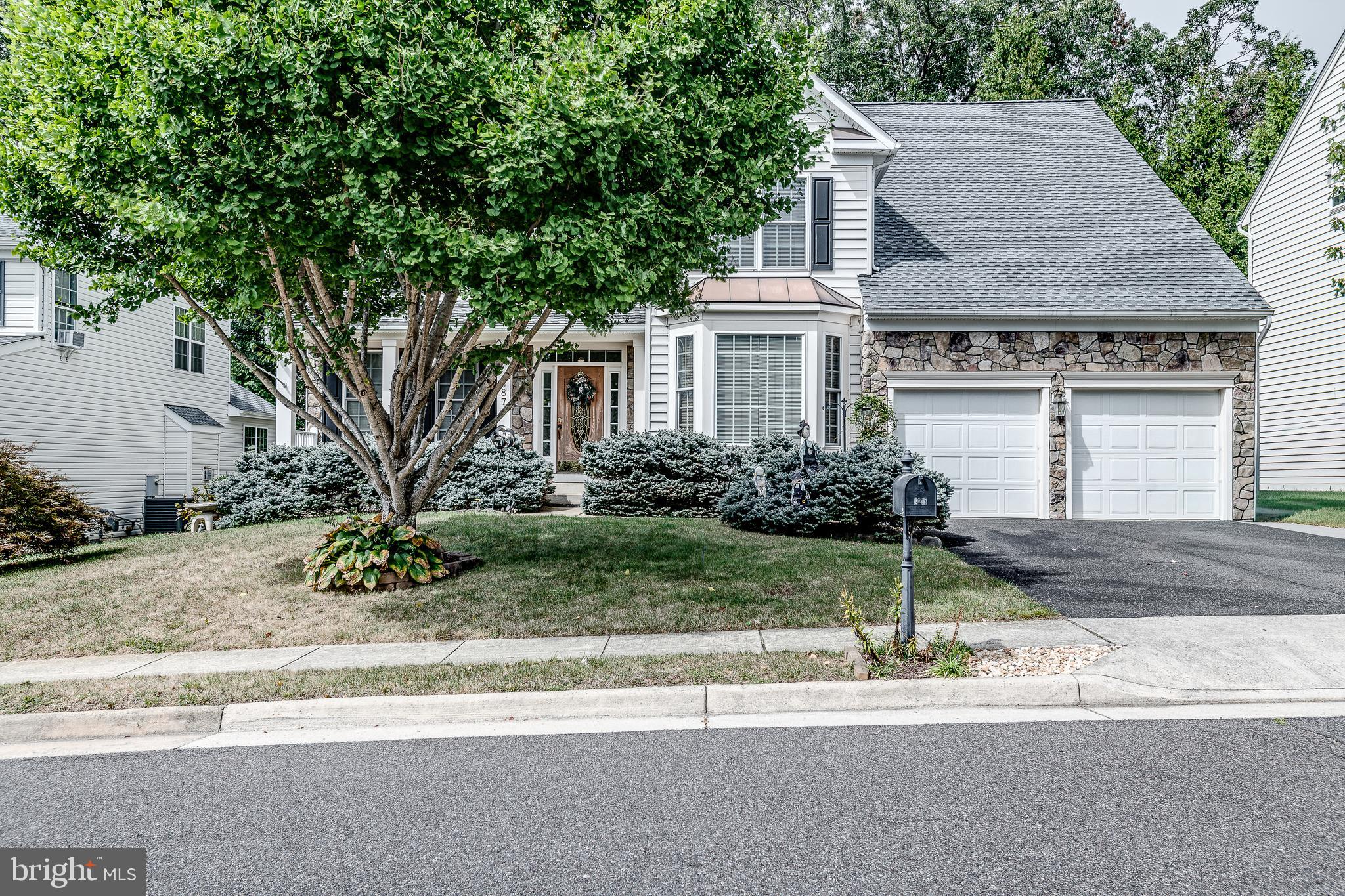 687 Hunters Road Culpeper, VA 22701 - Photo 50 of 57 a front view of a house with a yard and a garage