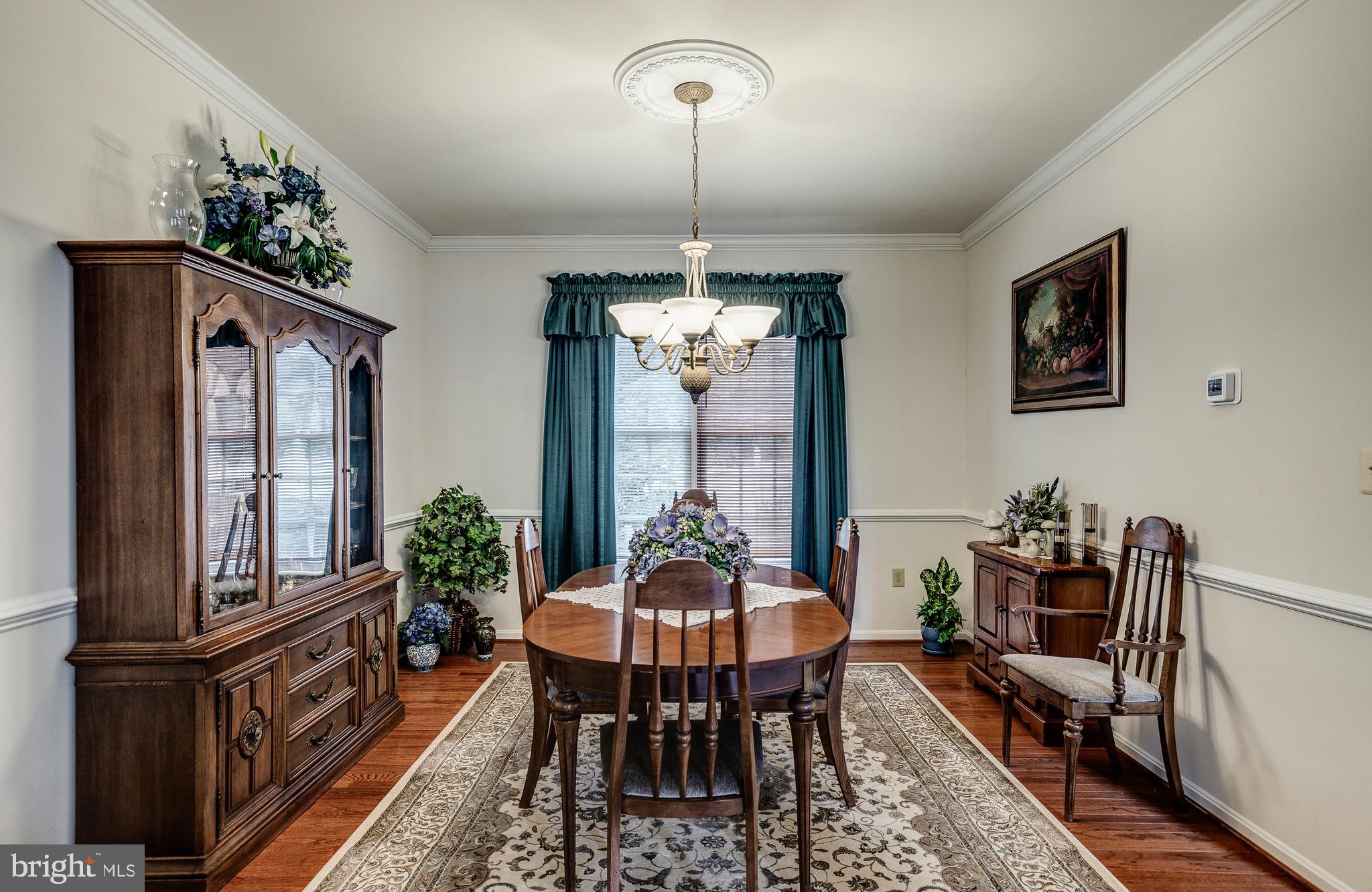 687 Hunters Road Culpeper, VA 22701 - Photo 7 of 57 a dining room with furniture a chandelier and window