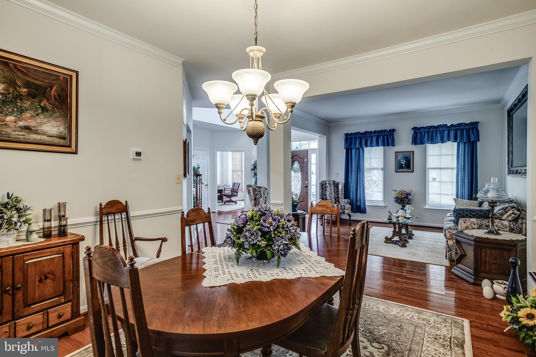 687 Hunters Road Culpeper, VA 22701 - Photo 8 of 57 a view of a dining room with furniture window and wooden floor