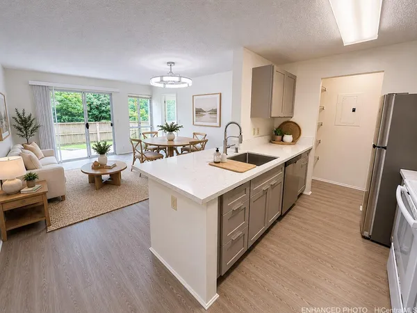 a kitchen with sink and refrigerator