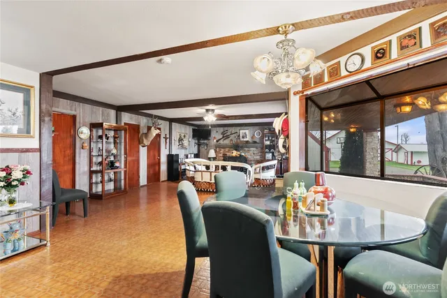 a kitchen with stainless steel appliances granite countertop lots of counter top space and wooden floor