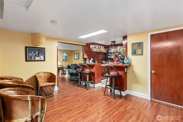 a view of a patio with table and chairs near a ceiling fan