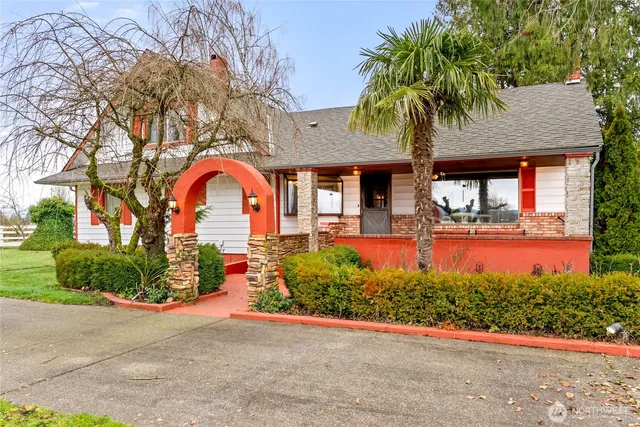 a front view of house with yard and green space
