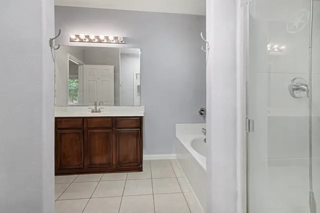 a bathroom with a sink a vanity and a mirror