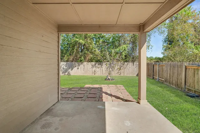 a view of a porch with a yard