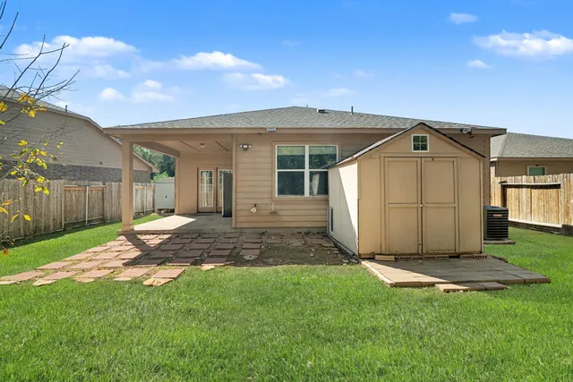 a view of a back yard of the house