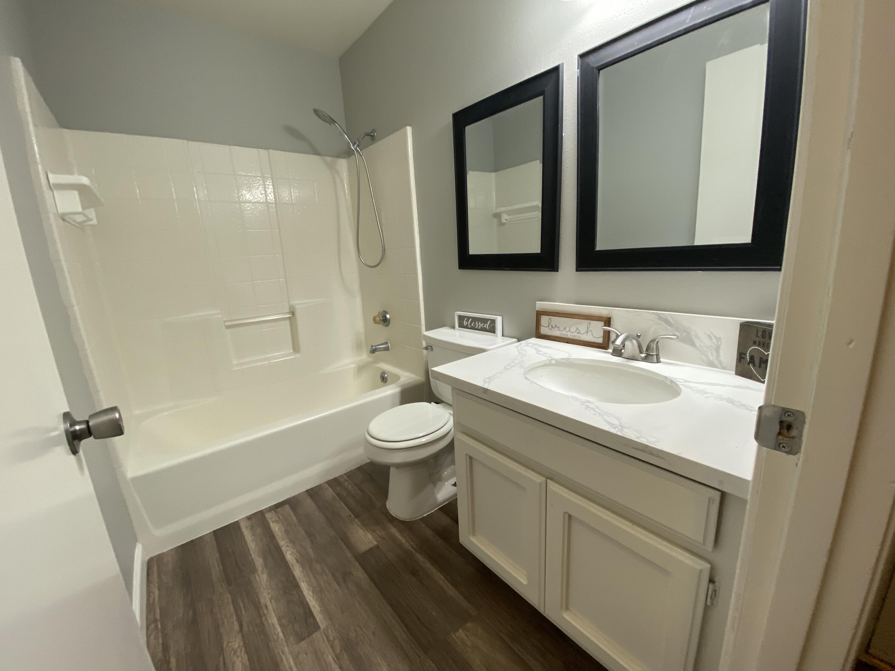 1241 South Ranger Street Ridgecrest, CA 93555 - Photo 14 of 26 a bathroom with a sink toilet and shower