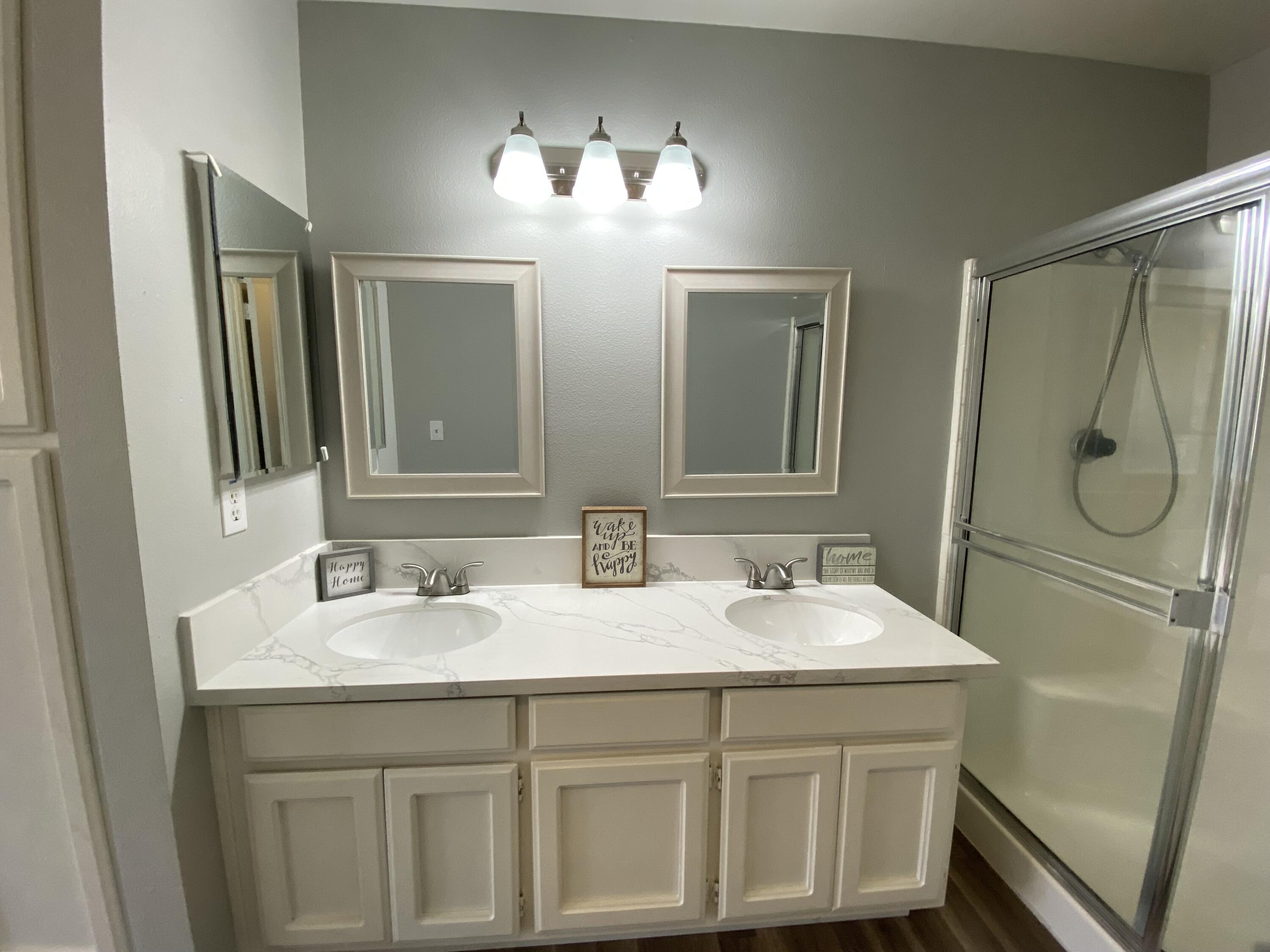 1241 South Ranger Street Ridgecrest, CA 93555 - Photo 18 of 26 a bathroom with a sink and a mirror