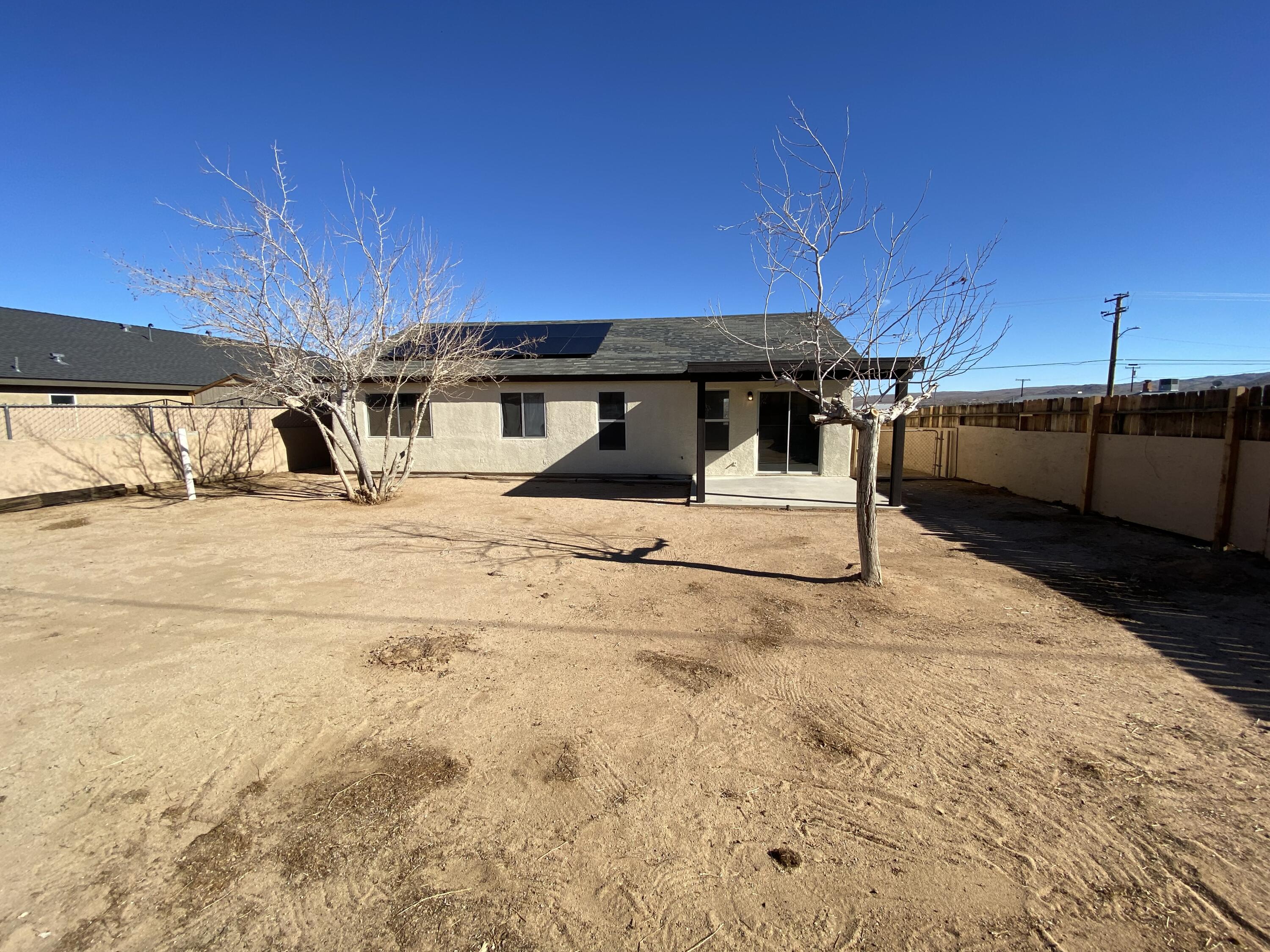 1241 South Ranger Street Ridgecrest, CA 93555 - Photo 20 of 26 a view of a house with a snow in the yard