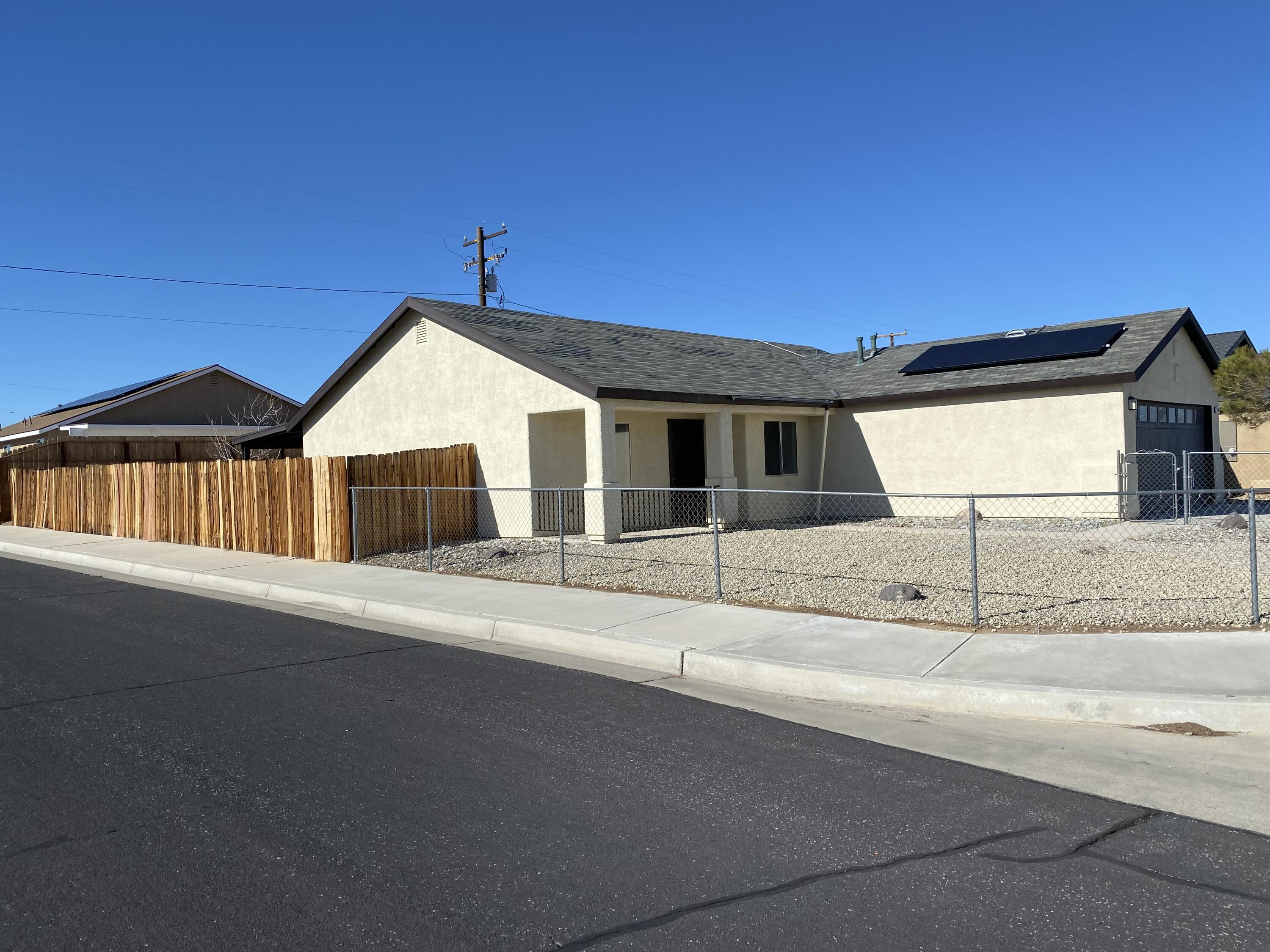 1241 South Ranger Street Ridgecrest, CA 93555 - Photo 4 of 26 a front view of a house with a road