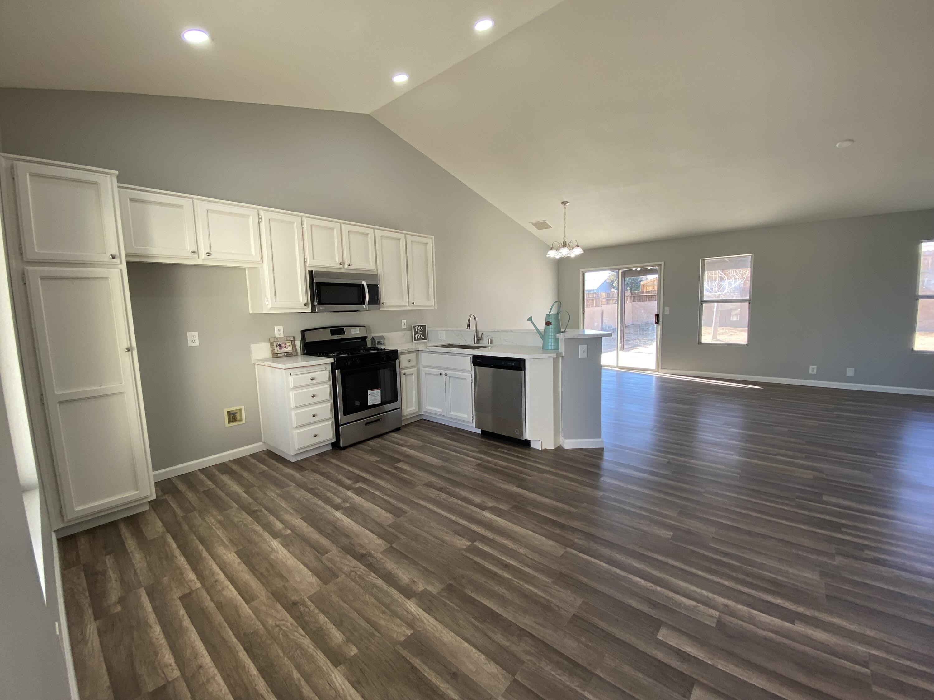 1241 South Ranger Street Ridgecrest, CA 93555 - Photo 5 of 26 a view of kitchen with microwave and refrigerator
