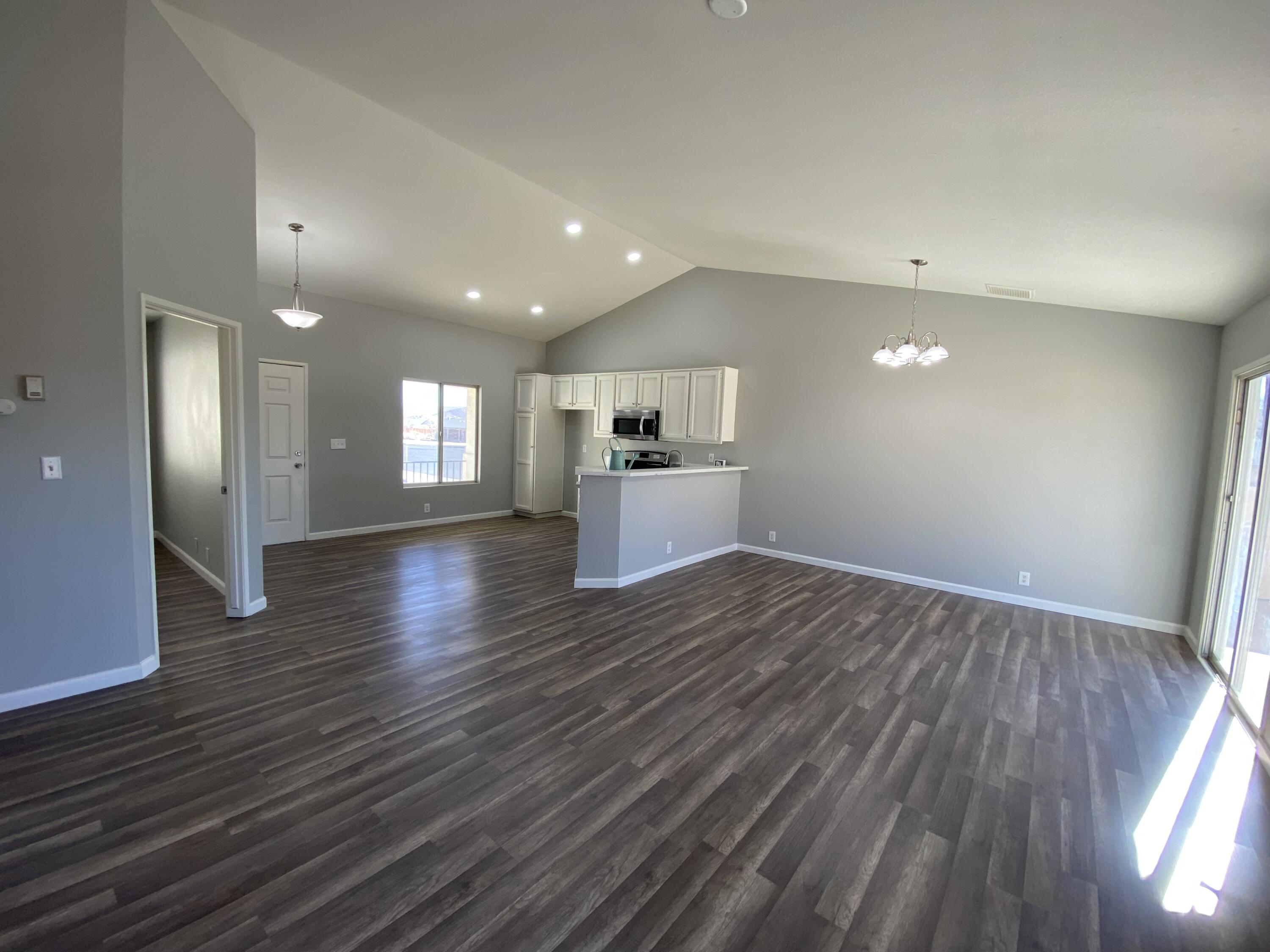 1241 South Ranger Street Ridgecrest, CA 93555 - Photo 6 of 26 a view of a kitchen with a sink and a refrigerator