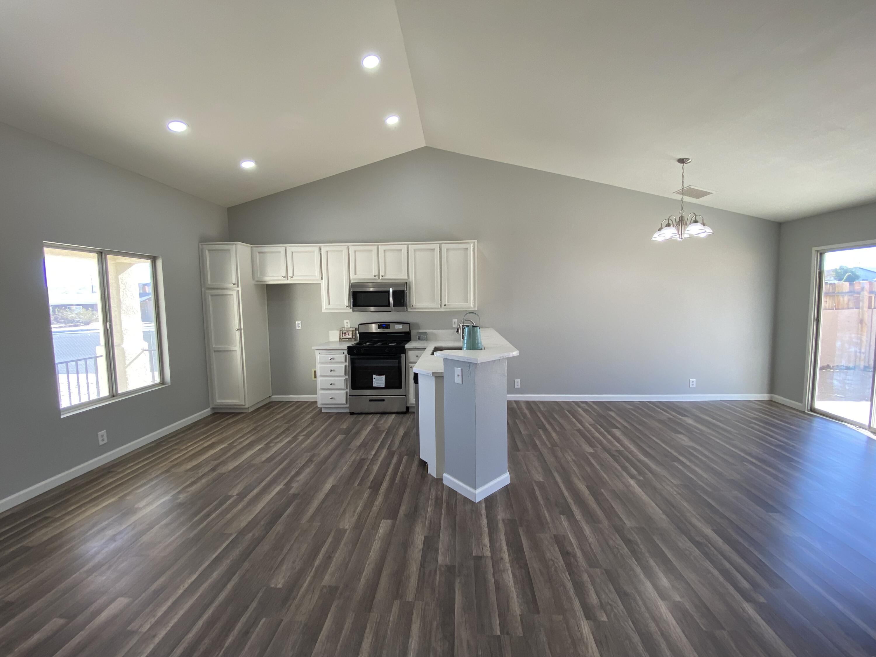 1241 South Ranger Street Ridgecrest, CA 93555 - Photo 7 of 26 a view of kitchen with furniture and wooden floor