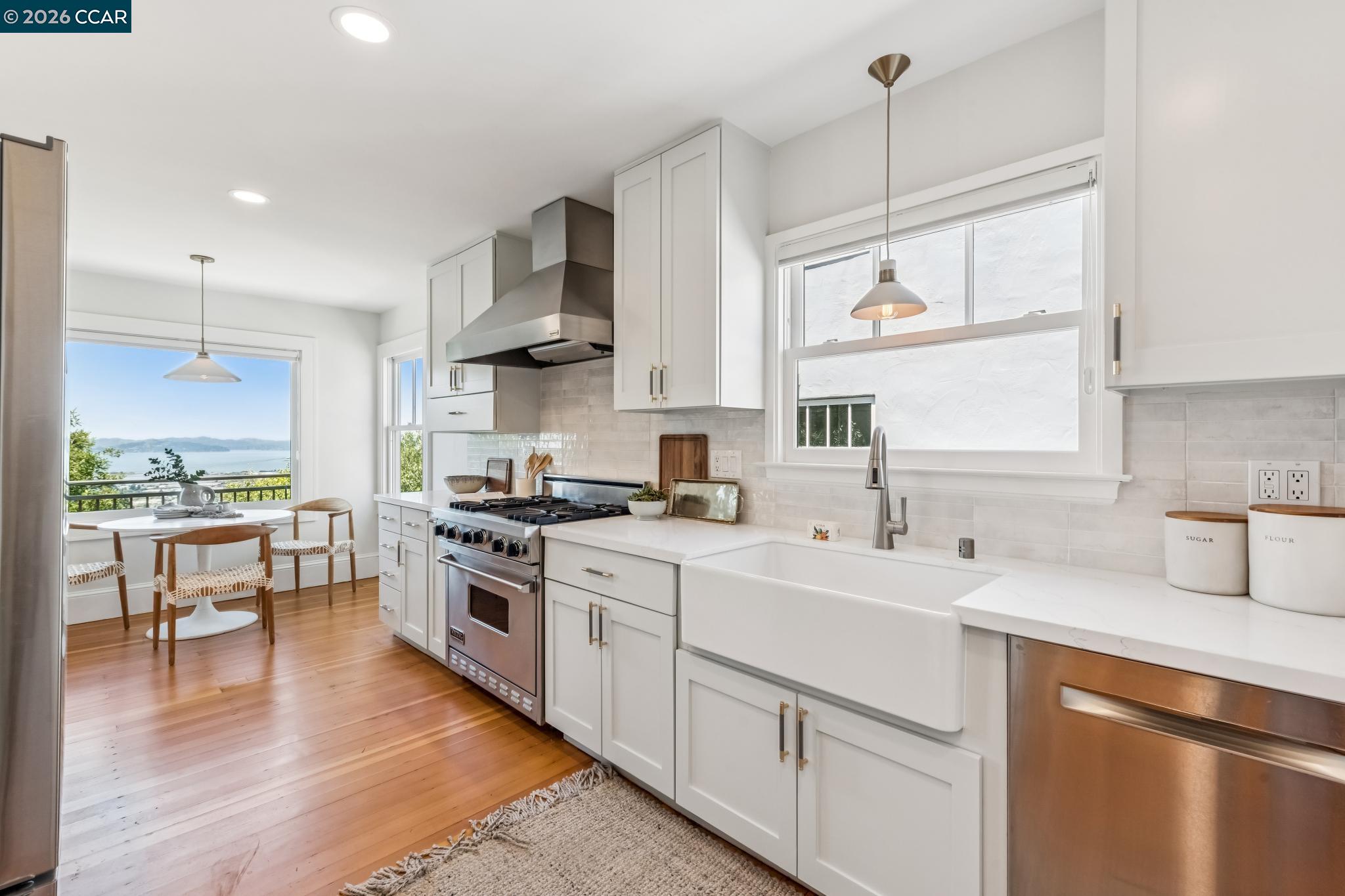 212 Yale Avenue Kensington, CA 94708 - Photo 22 of 70 a kitchen with a sink stove and wooden cabinets
