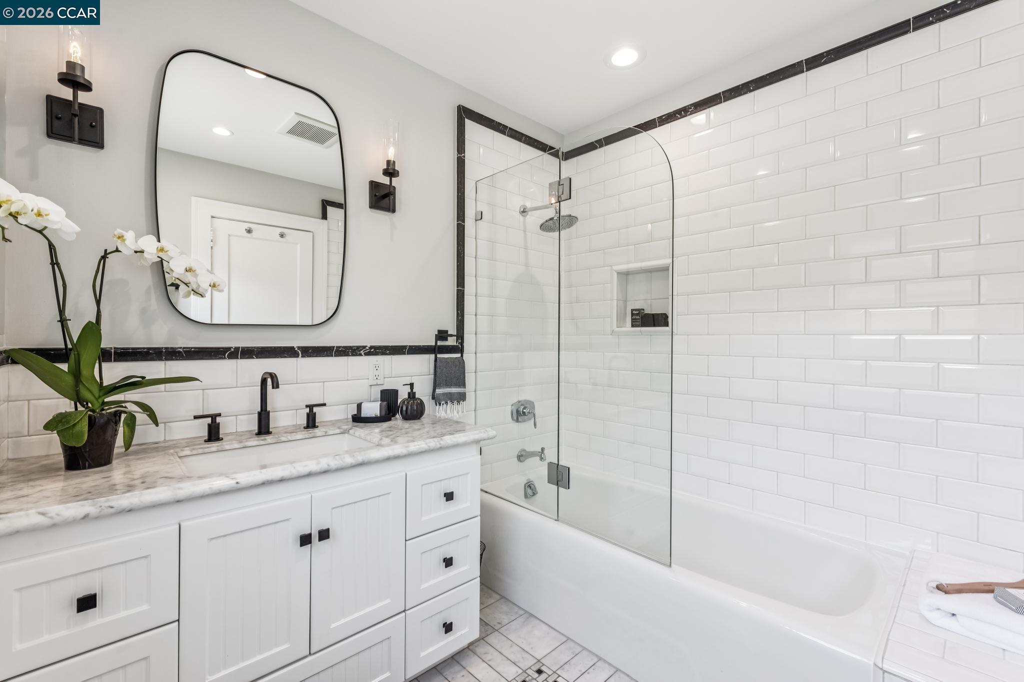 212 Yale Avenue Kensington, CA 94708 - Photo 32 of 70 a bathroom with a double vanity sink mirror double and bathtub