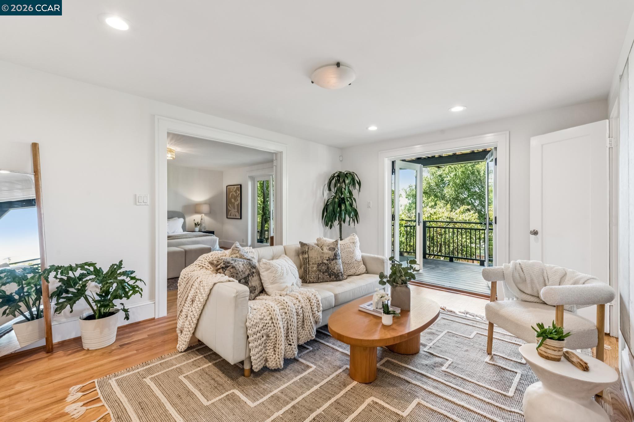 212 Yale Avenue Kensington, CA 94708 - Photo 36 of 70 a living room with furniture and a large window