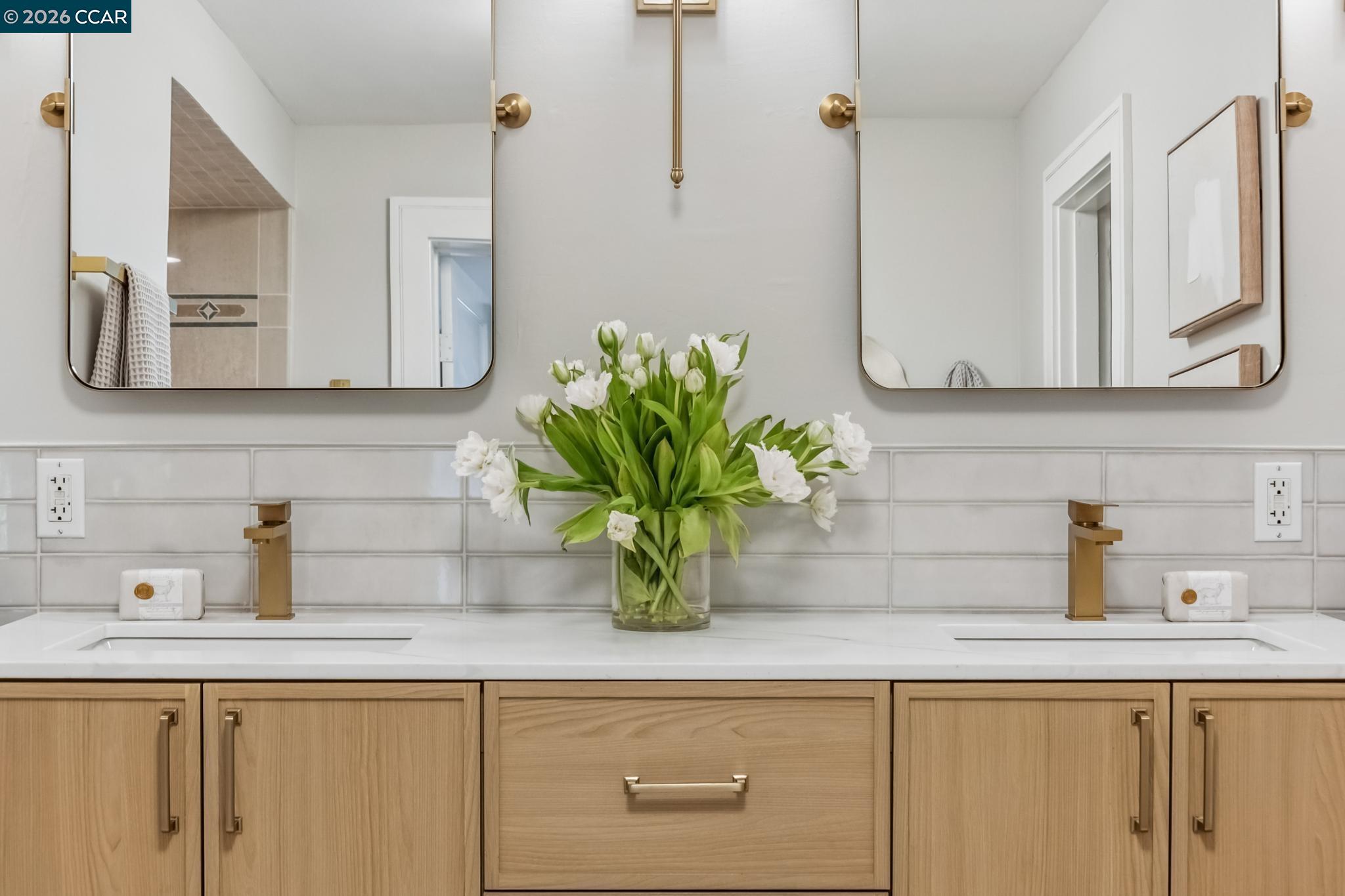 212 Yale Avenue Kensington, CA 94708 - Photo 42 of 70 a bathroom with a sink a vanity and mirror