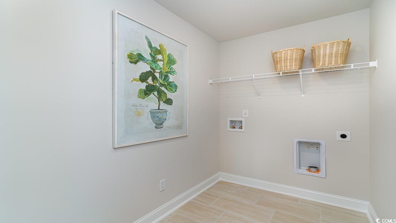 828 Hibernation Way Conway, SC 29526 - Photo 21 of 30 Laundry area featuring washer hookup, light wood-t