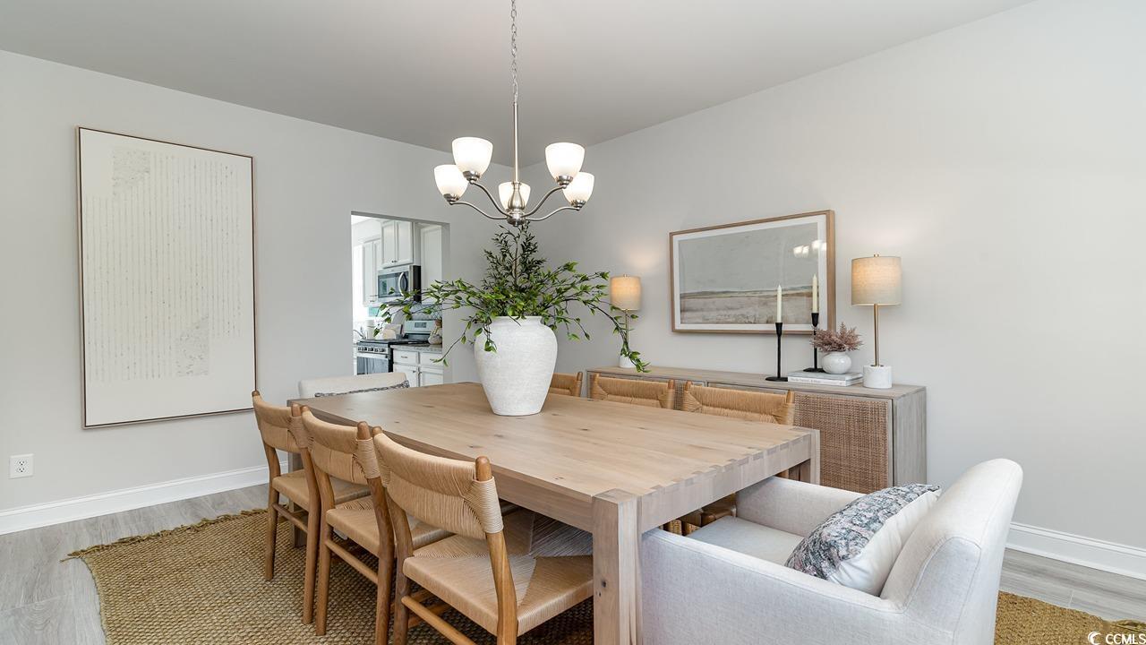 828 Hibernation Way Conway, SC 29526 - Photo 7 of 30 Dining room featuring light wood-type flooring and
